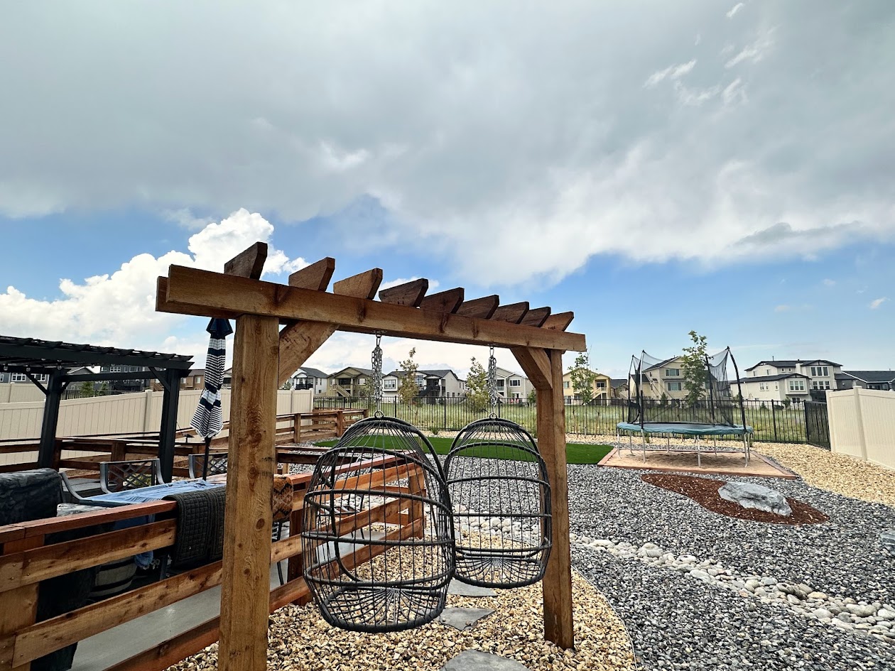 xeriscaping swing set dry creek river bed Colorado landscaping